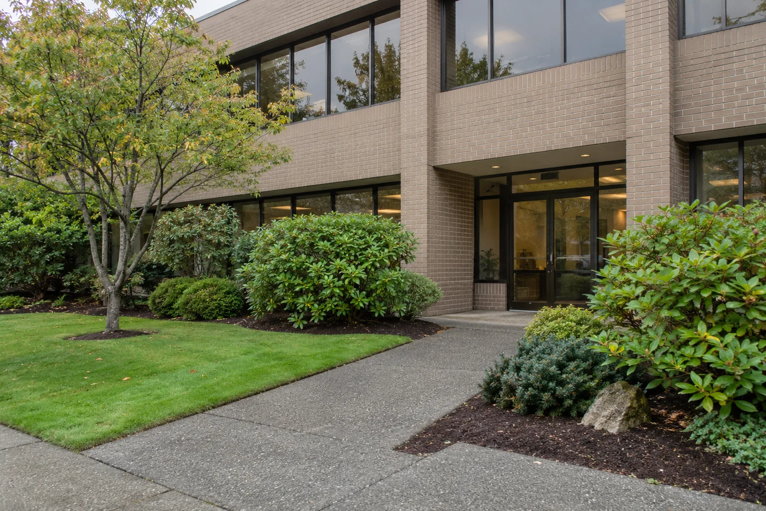 modest office building with landscaped grounds