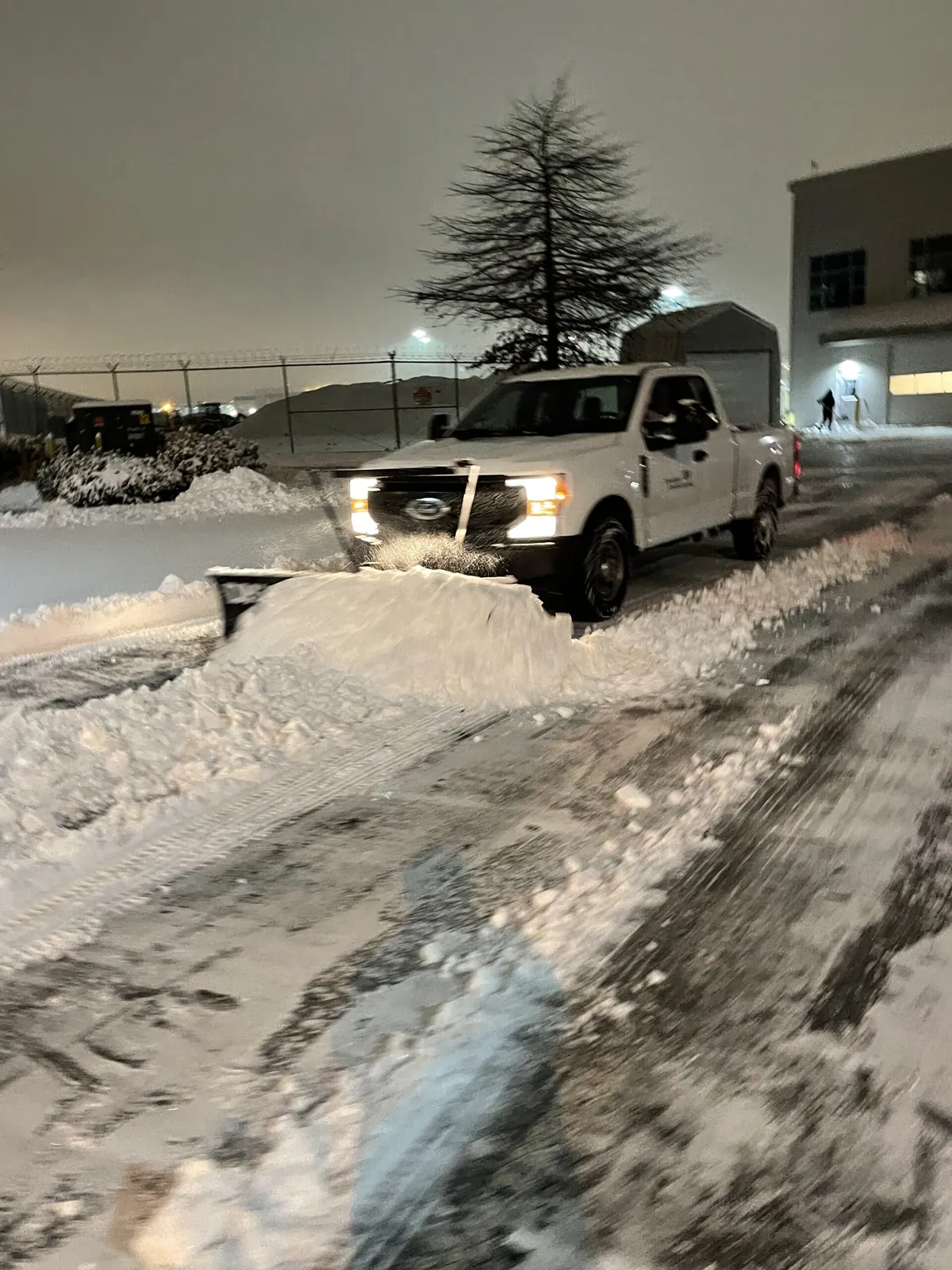 Snow plowing a commercial parking lot